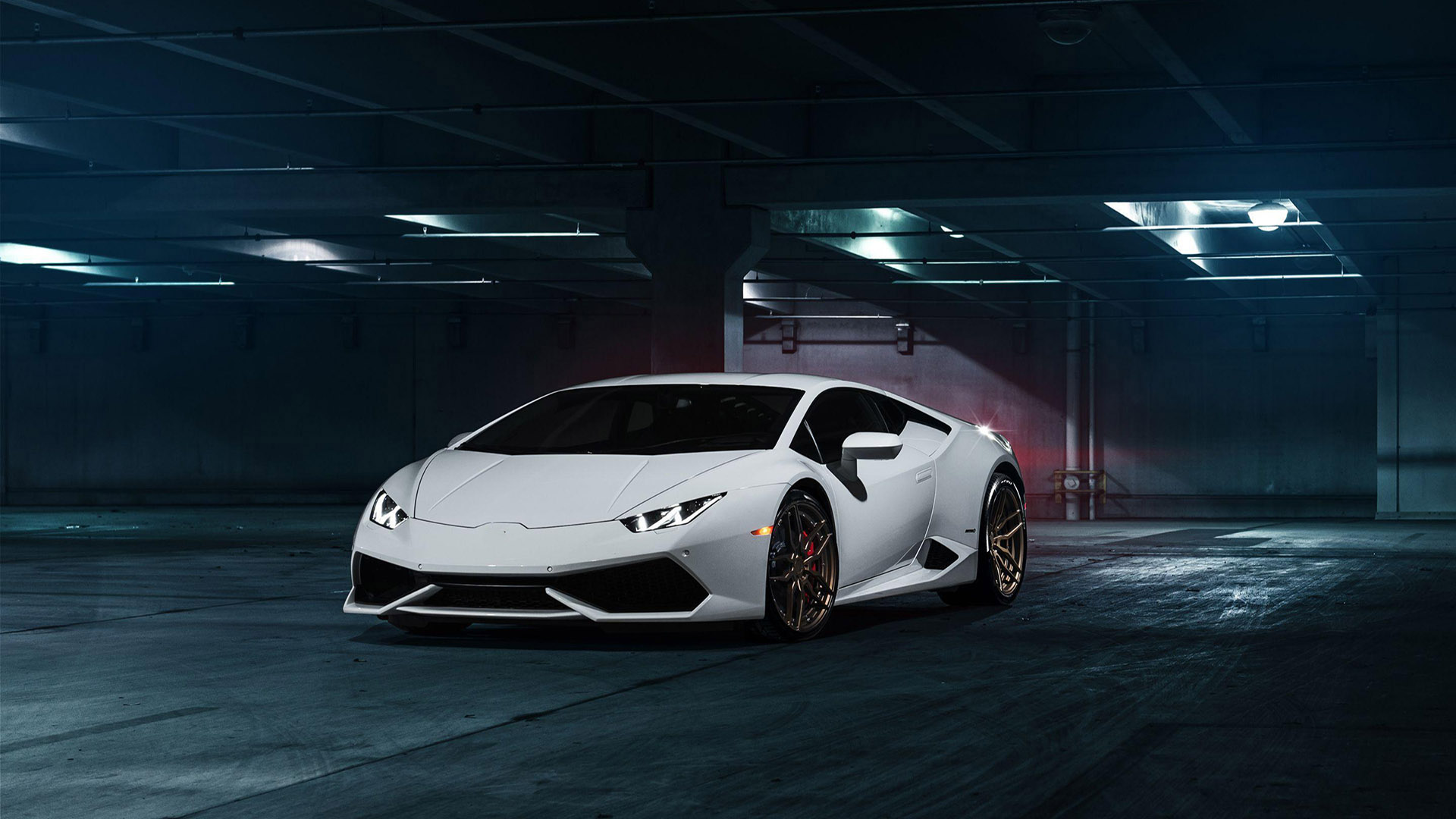 White sports car in an illuminated garage